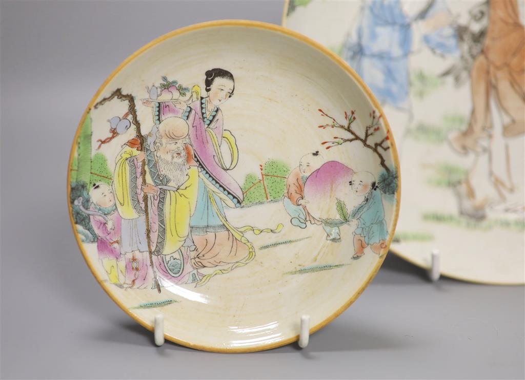 A large Chinese famille rose saucer dish and two similar small dishes, diameter of largest 22.5cm